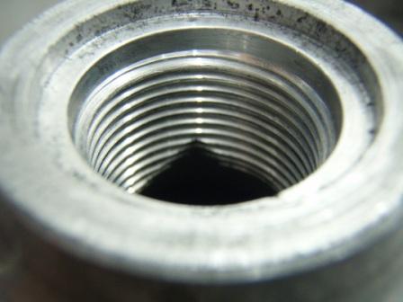 Is it a valley? is it a fold? A dificult call. it certainly comes up to within a few threads of the o-ring grove. Consult the cylinder testing standards or the manufacturer for clarification on this issue